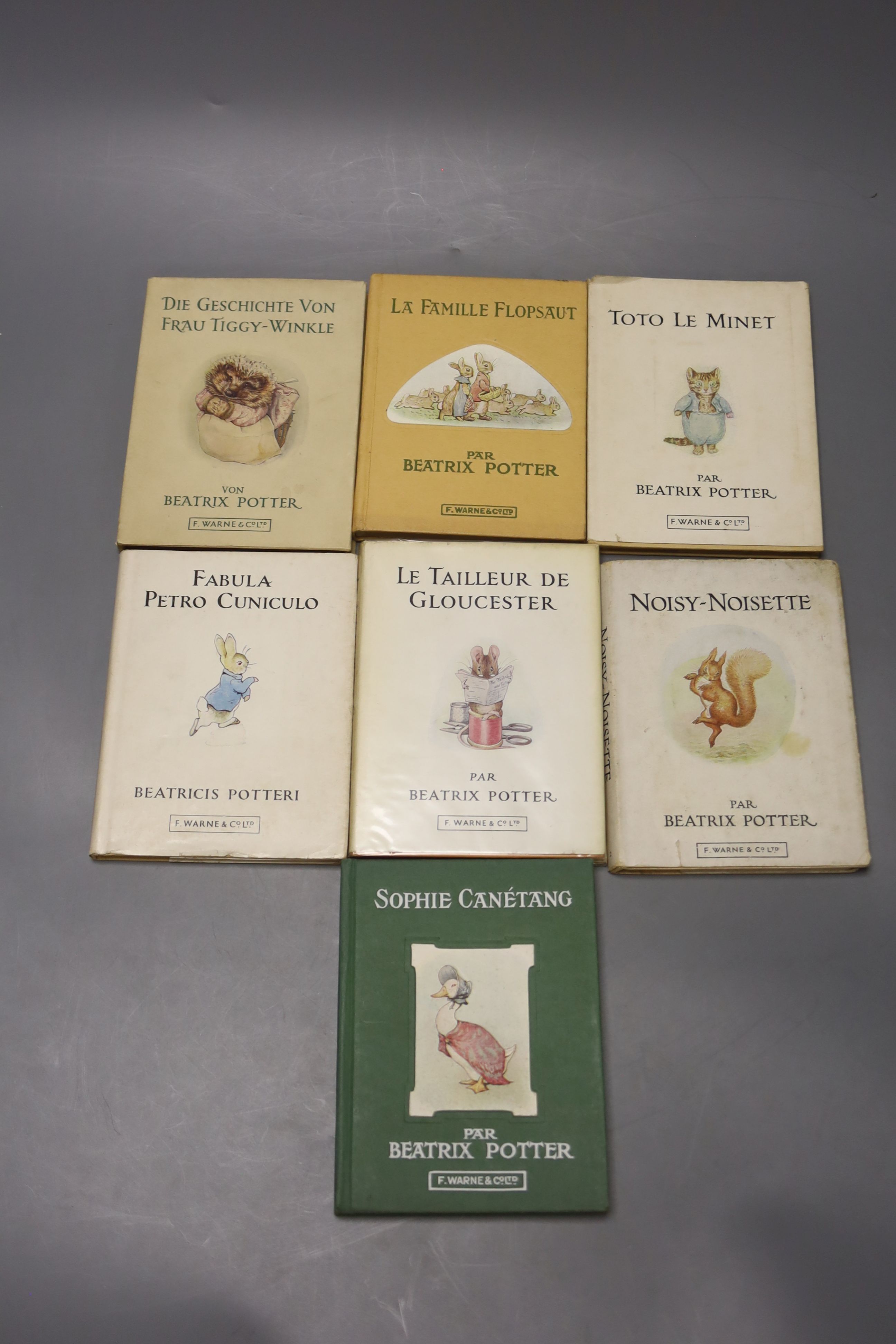 Potter, Beatrix, seven early foreign language editions, French 'La Famille Flopsaut', 'Sophie Canetang', Le Tailleur De Gloucester', 'Toto le Minet' and 'Noisy-Noisette together with German 'Die Geschichte Von Frau Tiggy